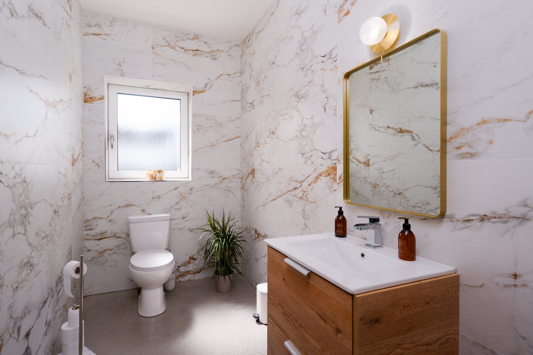 Marble Bathrooms — Book-matched marble, brass fittings and walk-in rainfal
