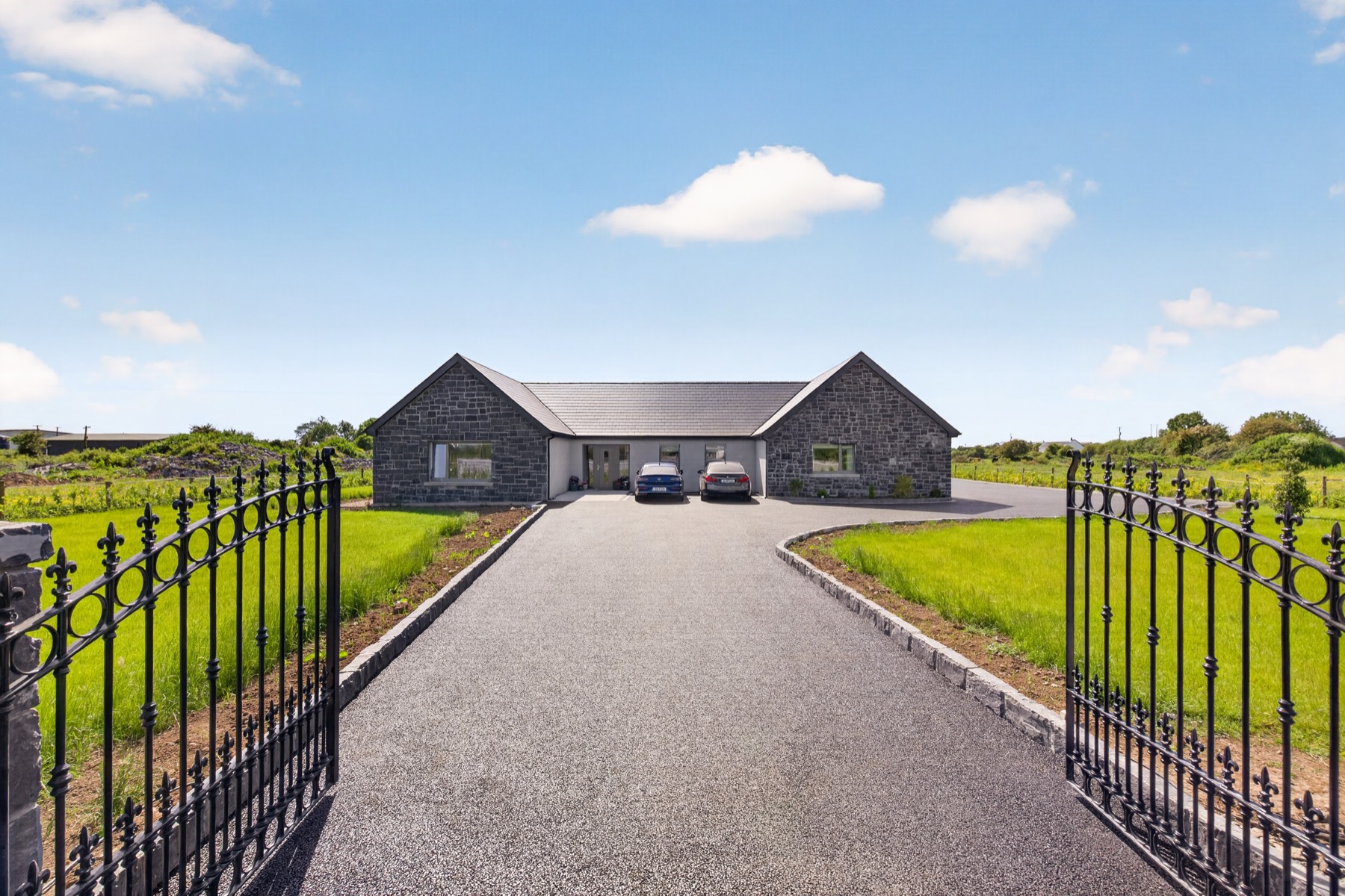 Gated entrance to Skylark Lodge with sweeping driveway