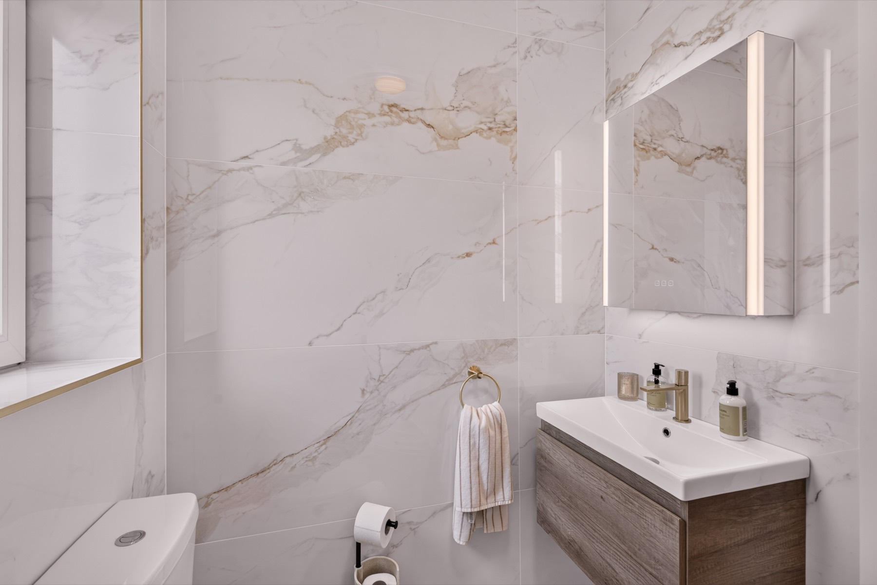 Marble Bathroom — A beautiful marble bathroom with a walk-in shower and c