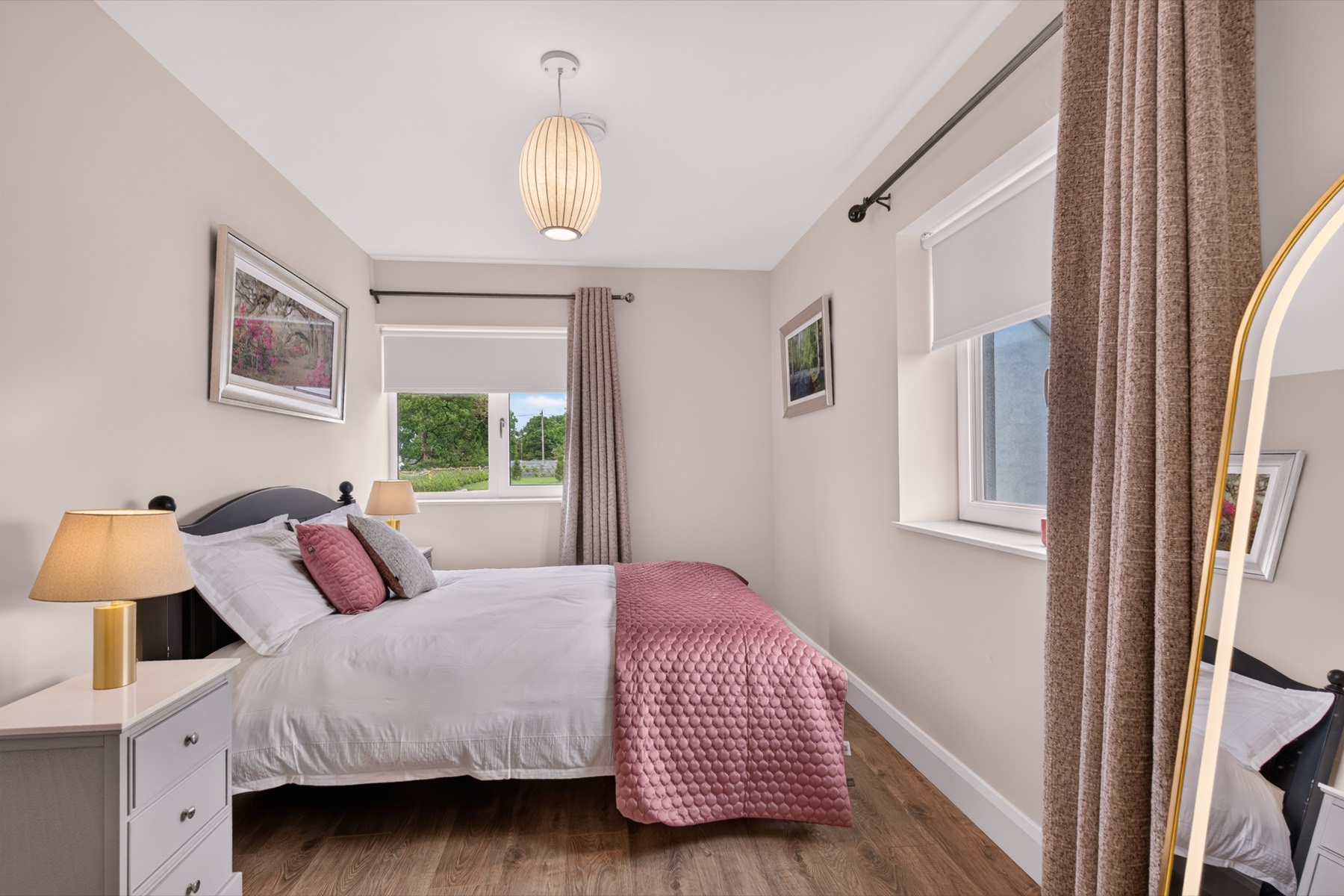 Four Restful Bedrooms — Four calm, well-dressed bedrooms in soft blush and navy